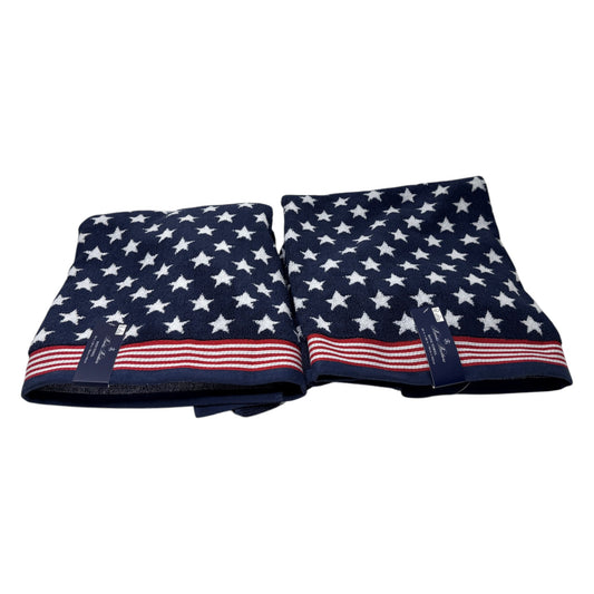 Set of two Brooks Brothers navy blue bath towels with all-over white star jacquard pattern and red and white stripe border, 30x56 inches, new with tags