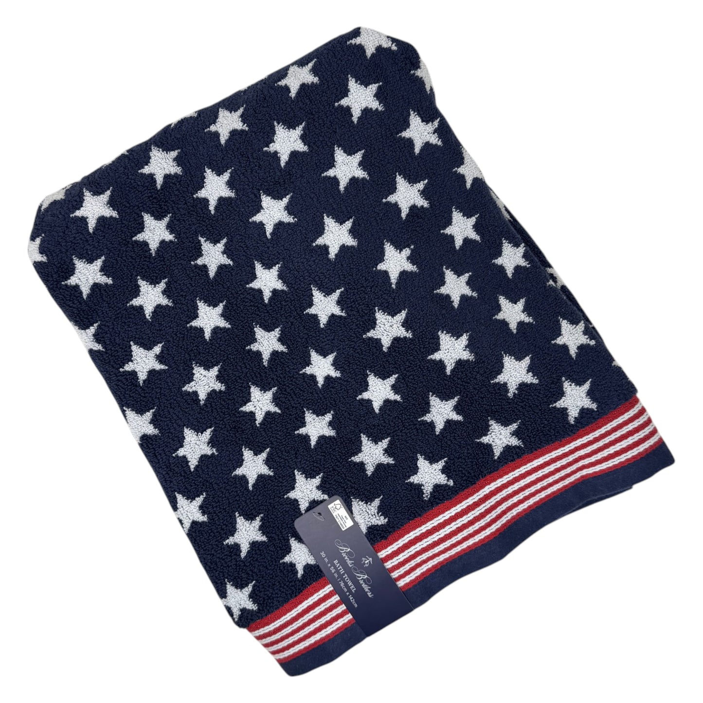 Set of two Brooks Brothers navy blue bath towels with all-over white star jacquard pattern and red and white stripe border, 30x56 inches, new with tags