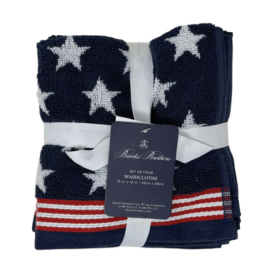 Set of four Brooks Brothers navy blue washcloths with all-over white star jacquard pattern and red and white stripe border, 13x13 inches, new with tags