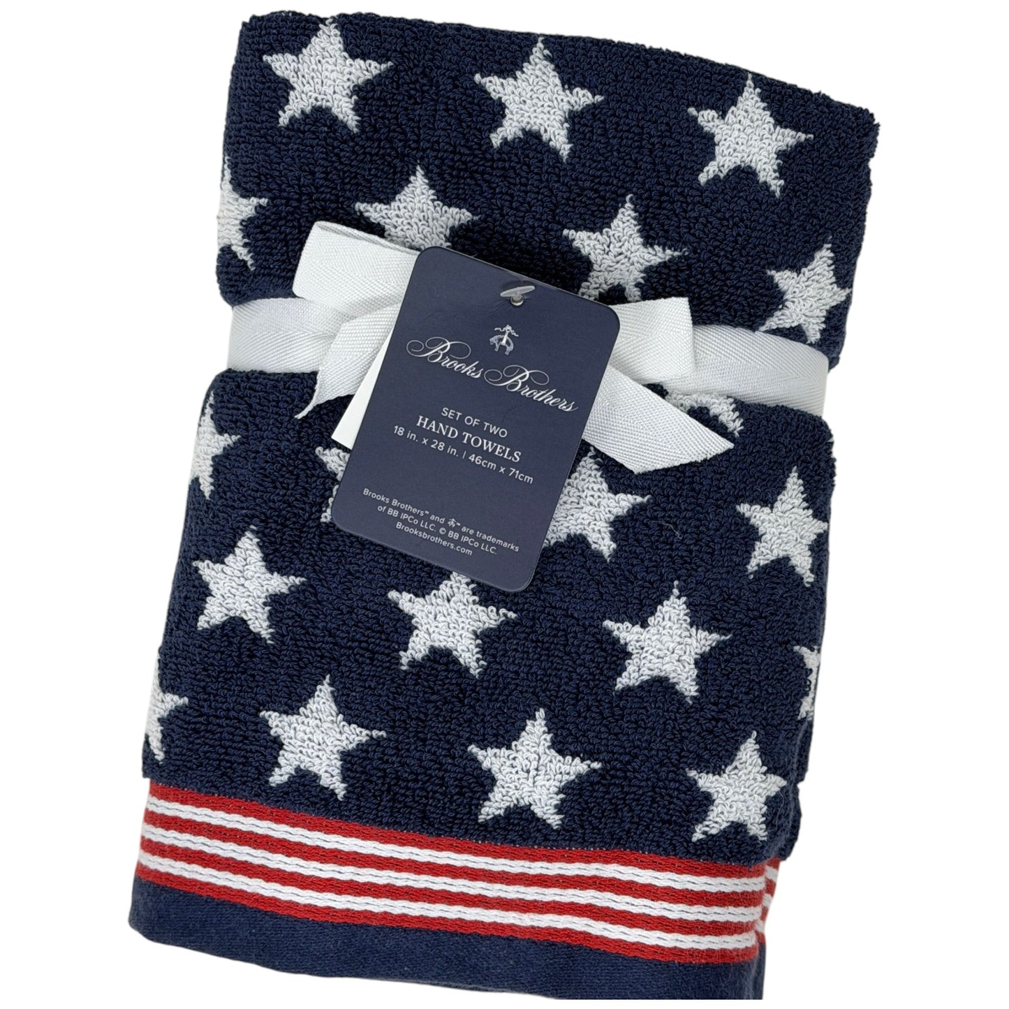 Set of two Brooks Brothers navy blue hand towels with all-over white star jacquard pattern and red and white stripe border, 18x28 inches, new with tags
