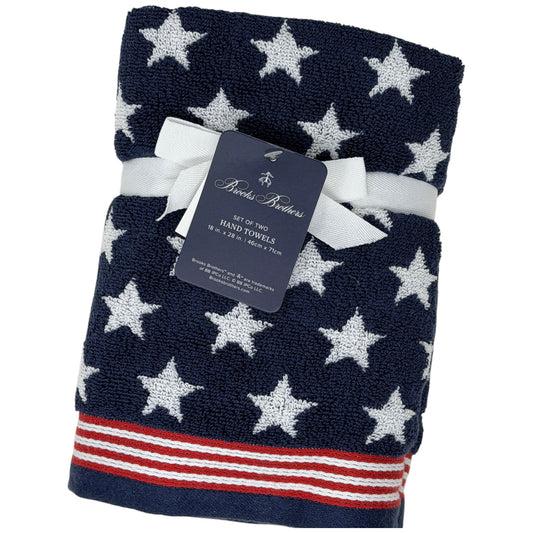Set of two Brooks Brothers navy blue hand towels with all-over white star jacquard pattern and red and white stripe border, 18x28 inches, new with tags

