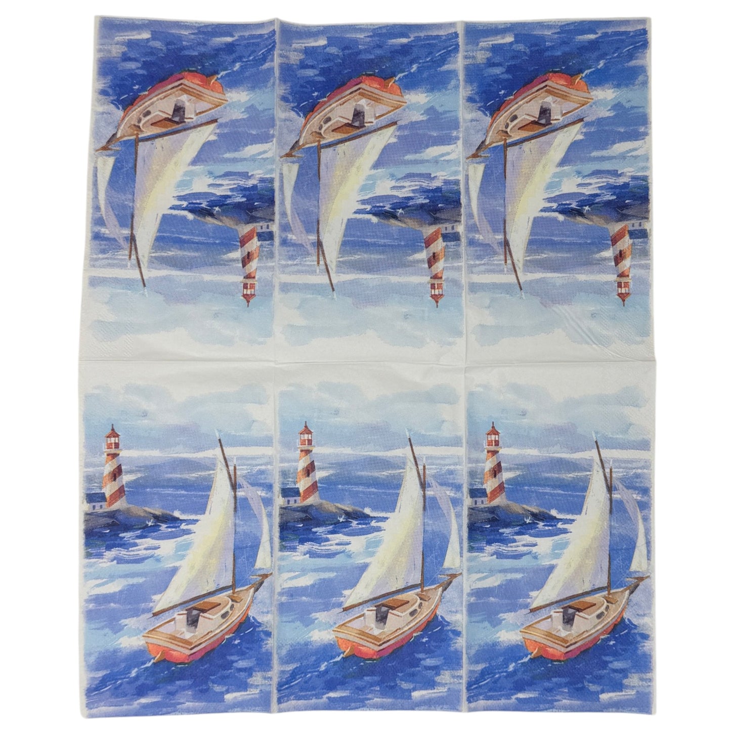 Guest-size decoupage paper napkin featuring a watercolor illustration of a classic wooden sailboat with white sails on deep blue choppy waves with a red and white striped lighthouse on rocky shores in the misty background, photographed on a white surface.