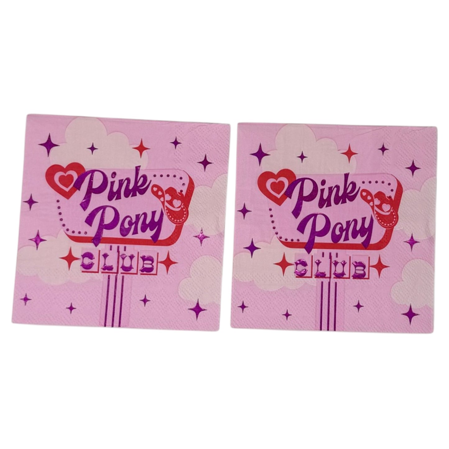 Cocktail-size decoupage paper napkin featuring a retro diner sign graphic with Pink Pony Club in shimmering foil purple lettering on a red marquee frame with a red heart, cowboy boot accent, sparkling four-point stars, and fluffy white clouds on a soft bubblegum pink background.