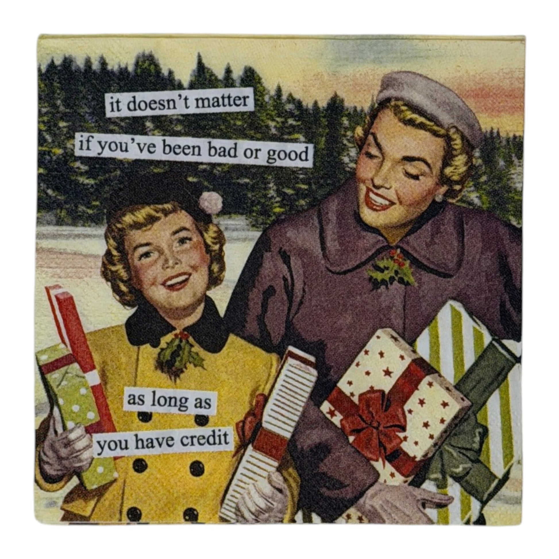 Cocktail-size decoupage paper napkin featuring a classic 1950s style illustration of two cheerful women in yellow and purple winter coats carrying colorful wrapped Christmas gifts outdoors against a snowy pine tree backdrop with a humorous cut-and-paste style caption about holiday shopping and credit, photographed on a white surface.