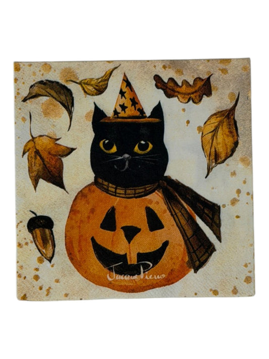 Cocktail-size decoupage paper napkin featuring a vintage illustration of a black cat in a gold star witch hat and plaid cape perched on a grinning orange jack-o-lantern surrounded by golden autumn leaves and an acorn on a warm aged parchment background with watercolor ink accents, photographed on a white surface.