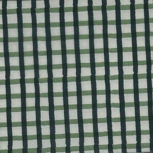 white paper napkin with a dark green check pattern