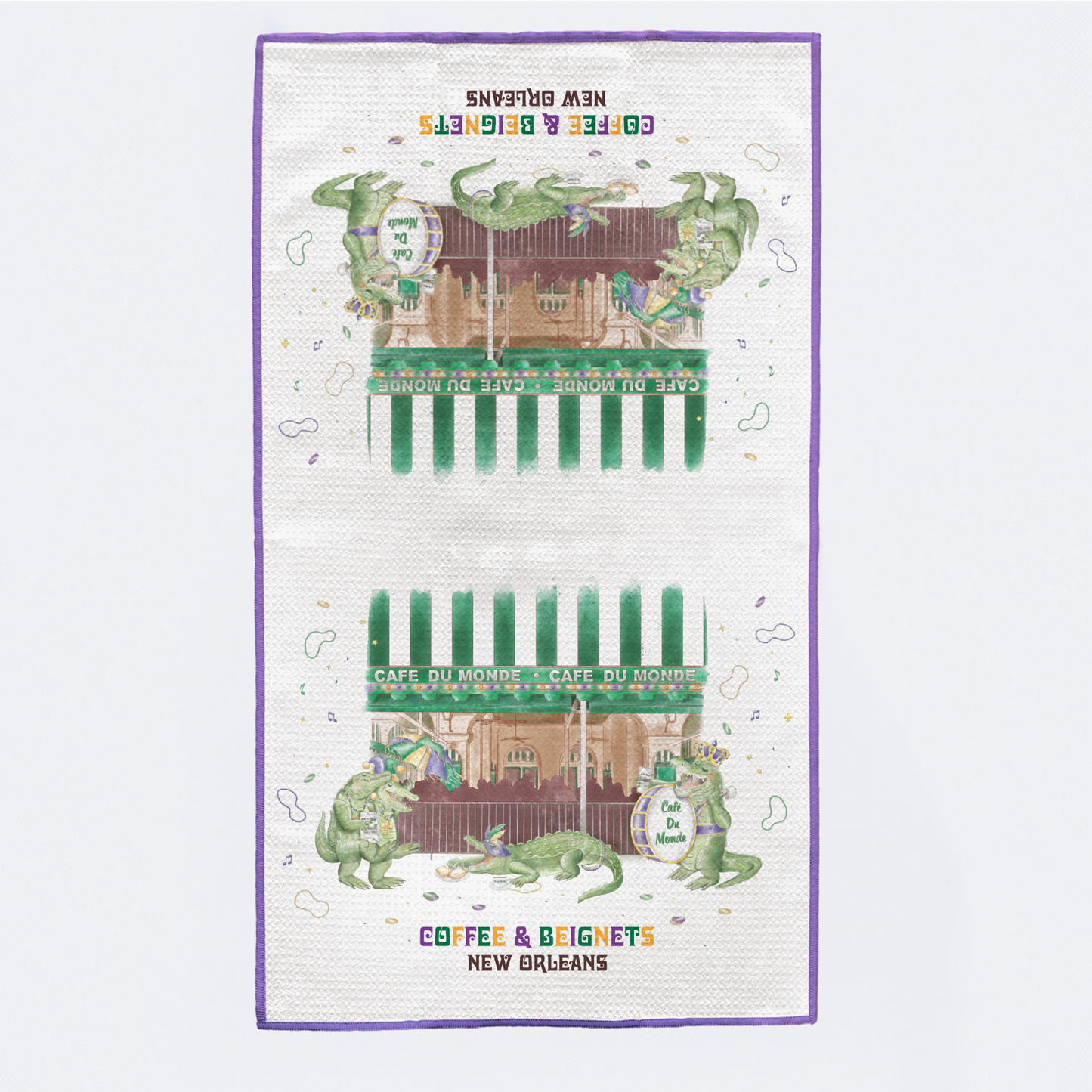 Tea towel with a design of Cafe du Monde in New Orleans, featuring green and white colors.
