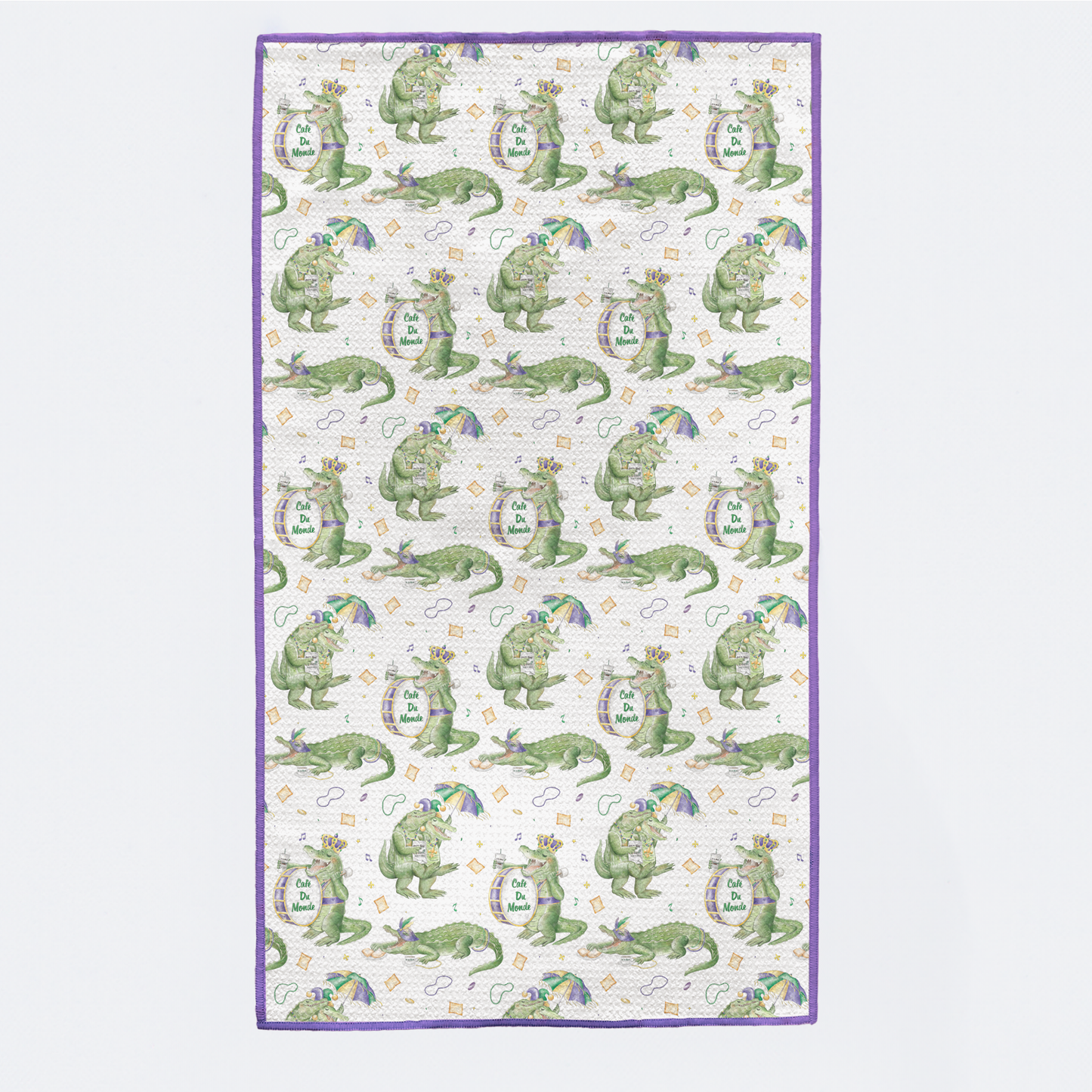 Patterned fabric with green alligator design on a white background