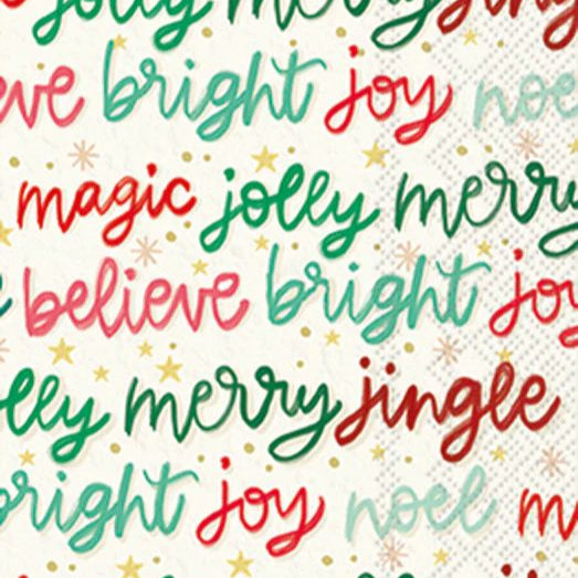 Guest size decoupage napkin featuring colorful Christmas word art with phrases like joy, merry, bright, jingle, and believe in red, green, and gold.