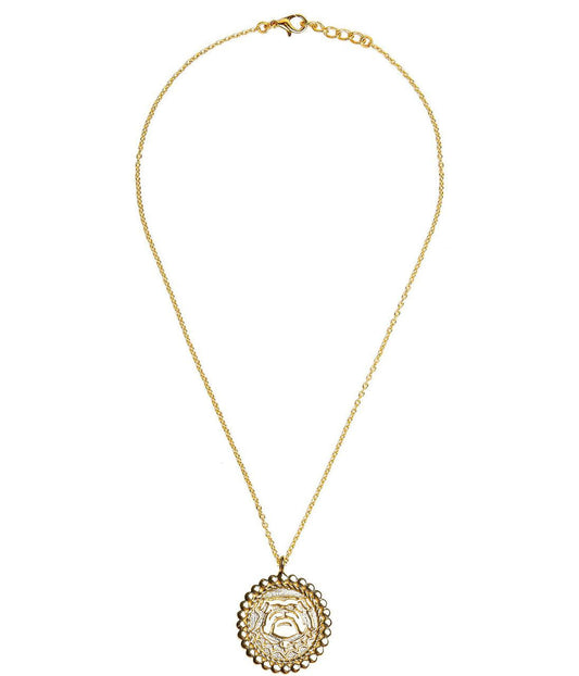 Gold necklace with a decorative pendant on a white background