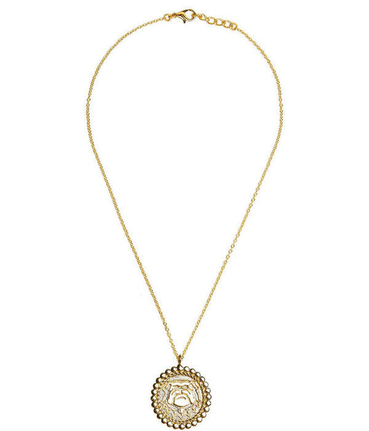 Gold necklace with a decorative pendant on a white background