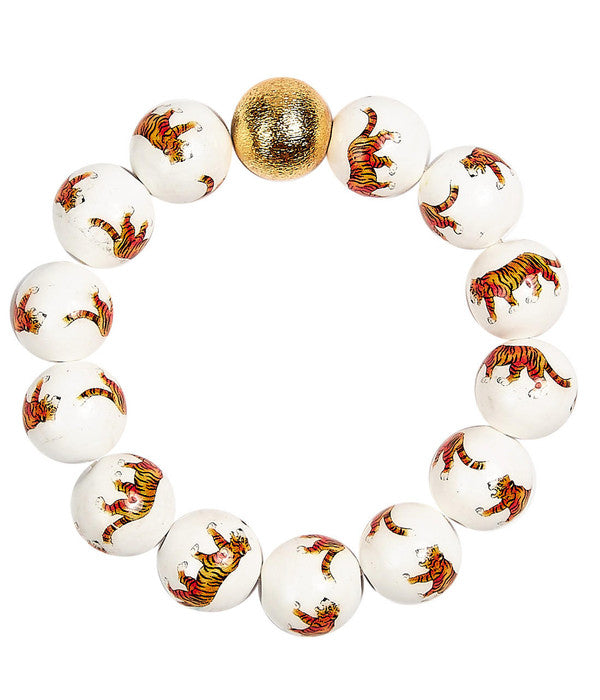 Bracelet with tiger-themed beads on a white background