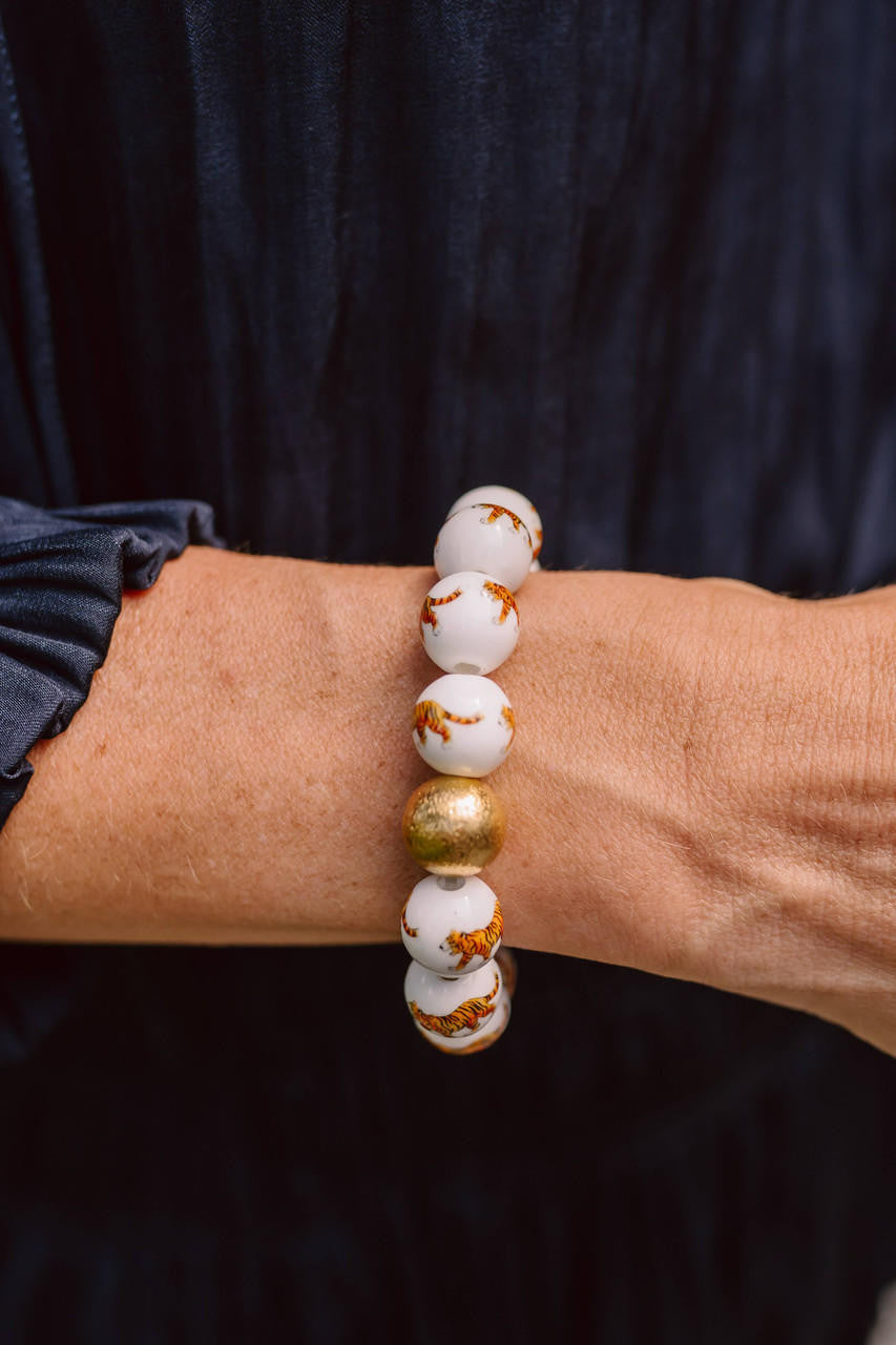 Beaded bracelet on a wrist with a dark background