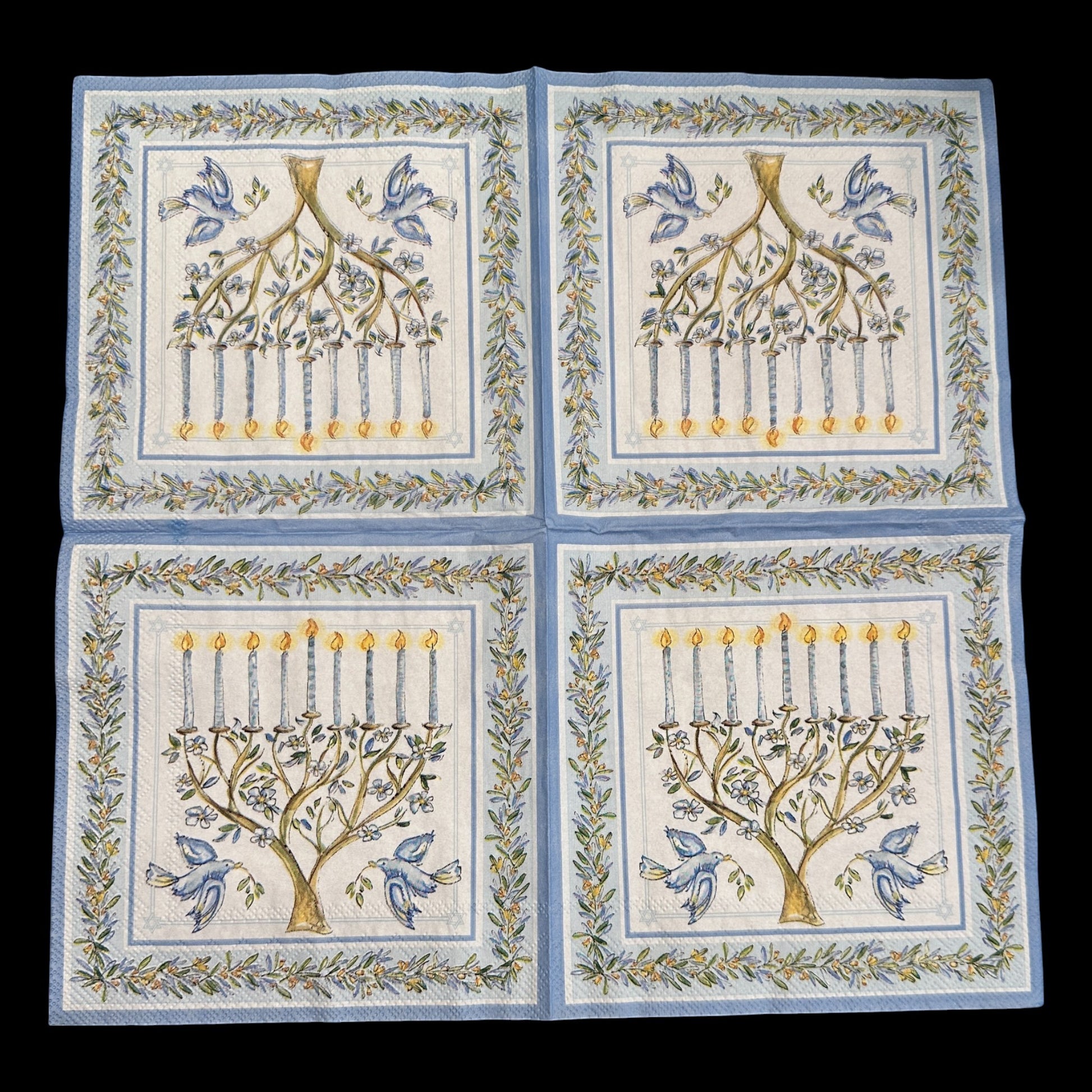 Loblolly Girl Roseanne Beck Menorah Luncheon Decoupage Napkins, set of 2, featuring a blue and white menorah with lit candles and blue birds, framed by a floral border.