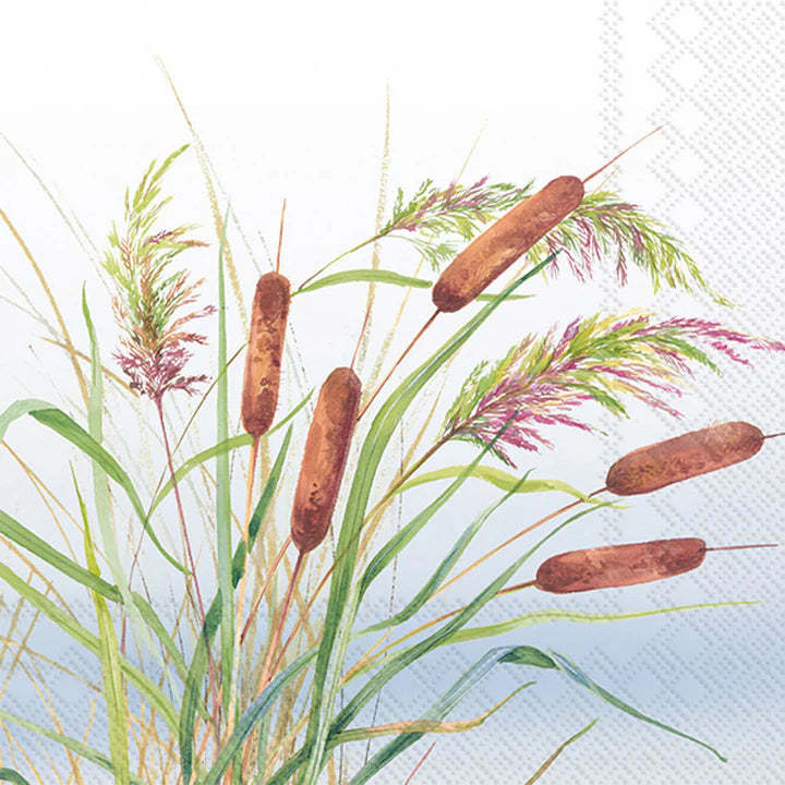 Luncheon size decoupage napkin featuring watercolor reeds and cattails in shades of green, brown, and purple on a blue sky background for nature crafts.