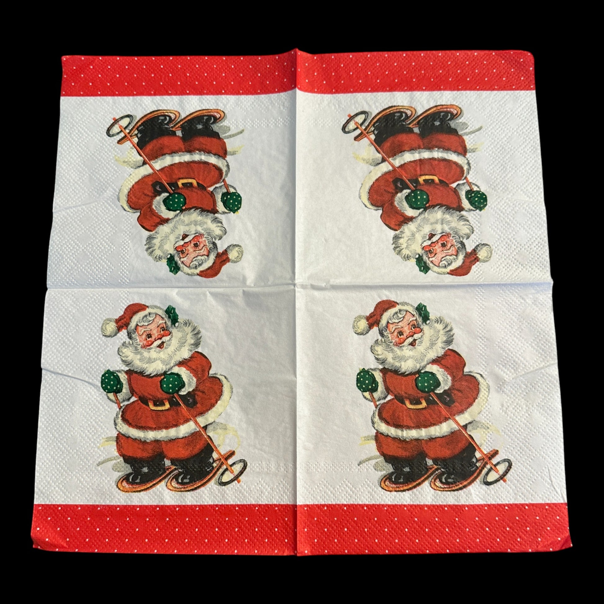 Unfolded Close-up of a cocktail napkin featuring a retro Santa Claus skiing with green mittens and a red suit, set against a white background with a red polka dot  border.