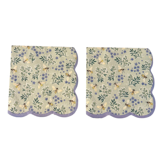 Luncheon size decoupage napkin featuring golden honeybees and white herb blossoms with periwinkle wildflowers on a sage green background with a scalloped lavender border set of 2